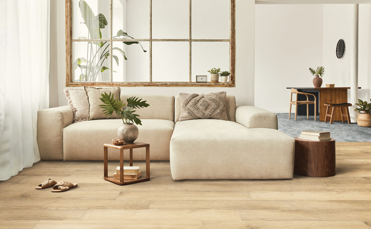 warm toned hardwood flooring in living room with natural decor.