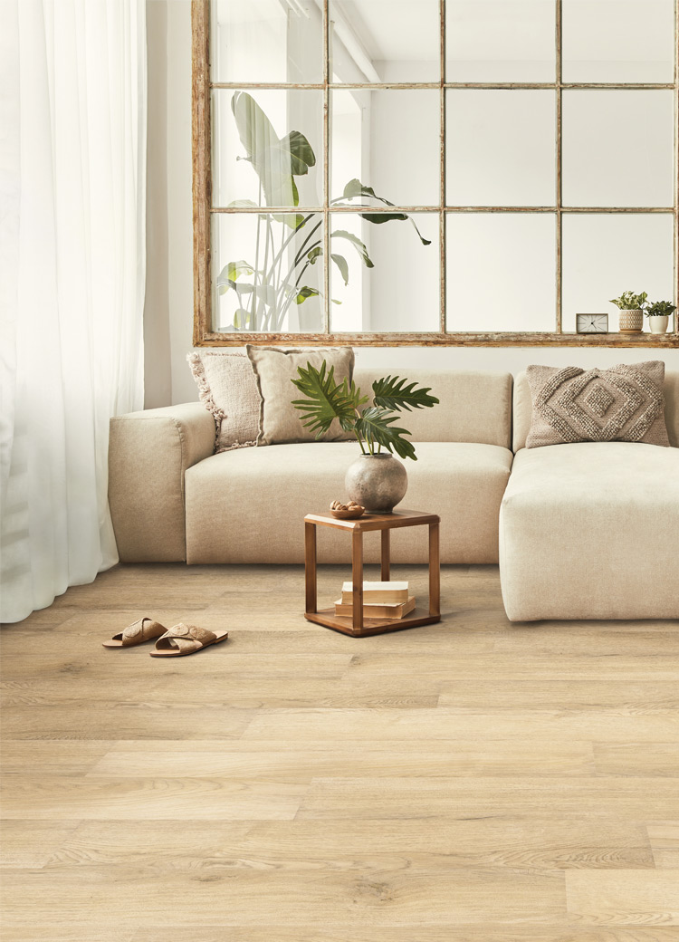 warm toned hardwood flooring in living room with natural decor.